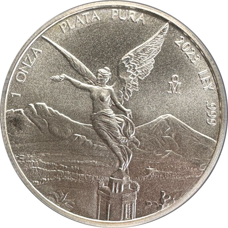 Reverse of a 2023 one-ounce silver Libertad: Winged Victory holding a laurel
                wreath and broken chain, with Popocat&eacute;petl and Iztacc&iacute;huatl behind